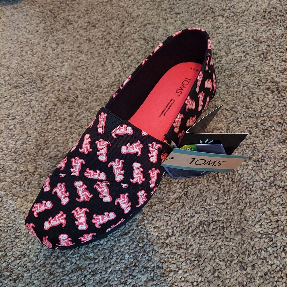 Tom's dinosaur shoes